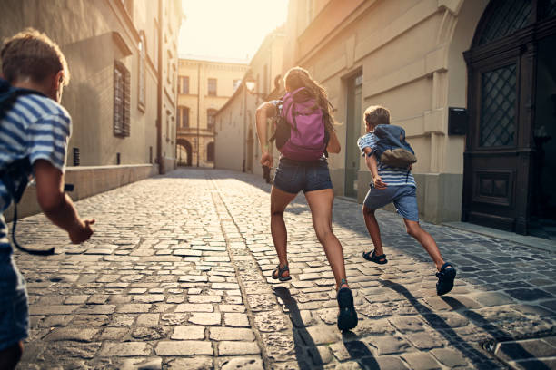 istock Kids running to school 1166560893