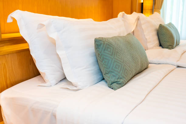 istock Beautiful luxury comfortable white pillow blanket on bed decoration in bedroom 1166561068