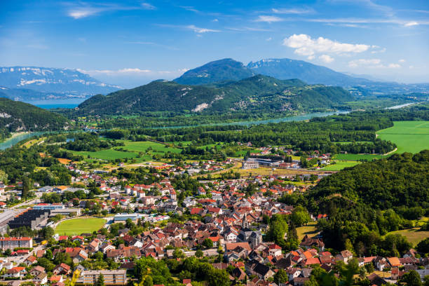 aerial view of beautiful french landscape in bugey mountains, in ain department auvergne-rhone-alpes region, with culoz small town, the rhone river and famous lake bourget in background in summer - france european alps landscape meadow imagens e fotografias de stock