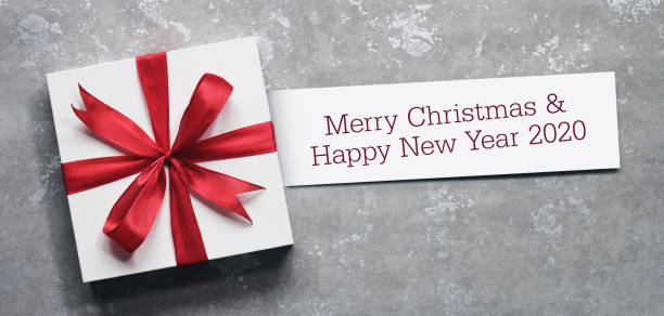 istock Christmas gift box with greeting card. 1166568551