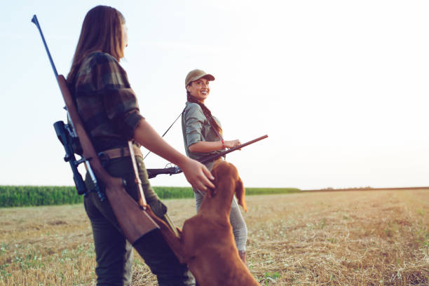 istock Women hunters with hunting dog 1166569481