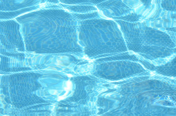istock Surface of blue swimming pool. Background texture of water. - image 1166569555