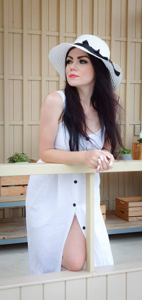 istock Woman in white enjoying the view from a barn deck 1166569864