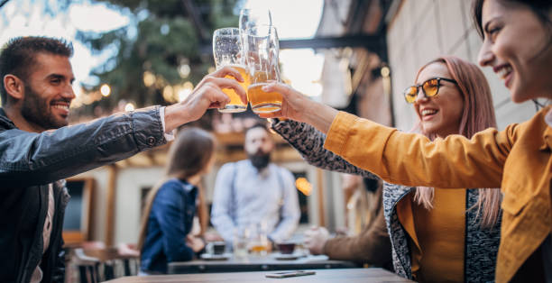 istock Friends drinking beer in pub outdoors 1166571486