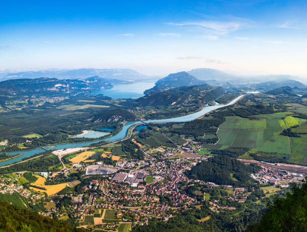 aerial view of beautiful french landscape in bugey mountains, in ain department auvergne-rhone-alpes region, with culoz small town, the rhone river and famous lake bourget in background in summer - france european alps landscape meadow imagens e fotografias de stock