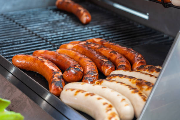 istock Delicious Germany sausage grilling on barbecue coal 1166572831