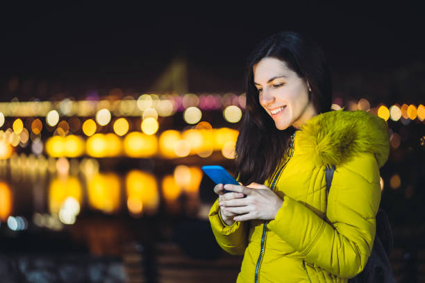 istock Woman texting at night 1166573751
