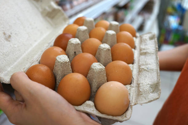 istock Close up of hand holding a pack of eggs 1166573872