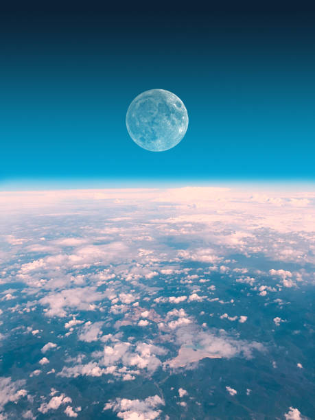 istock Half Moon rising from the Earth horizon above the clouds. My astronomy work. 1166574034