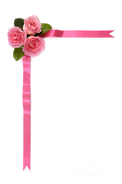 Floral corner border made from pink roses and satin ribbon.  Red version shown below: