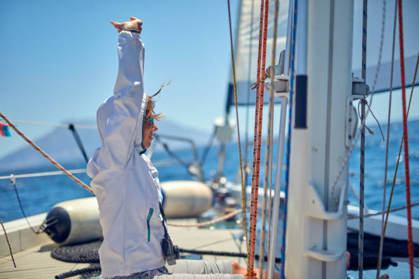 istock Young woman enjoying on a sailing boat. 1166576407