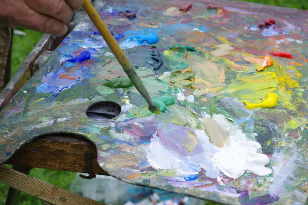 istock Drawing with oil paints on the nature. Palette 1166576493