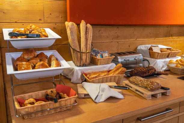 istock Assorted fresh pastry on table in breakfast buffet in hotel 1166577958