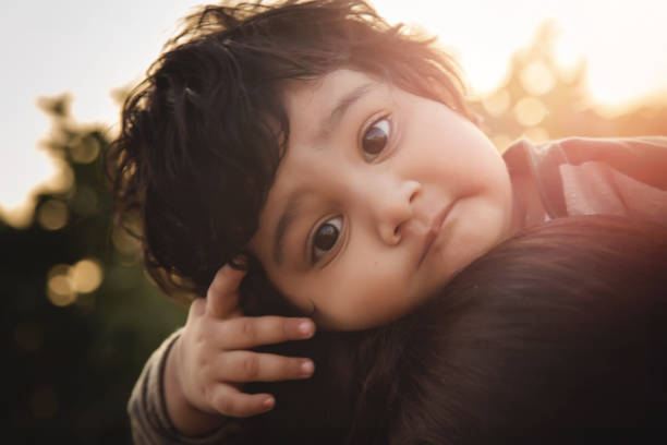 istock Mother hugging little daughter portrait 1166578031