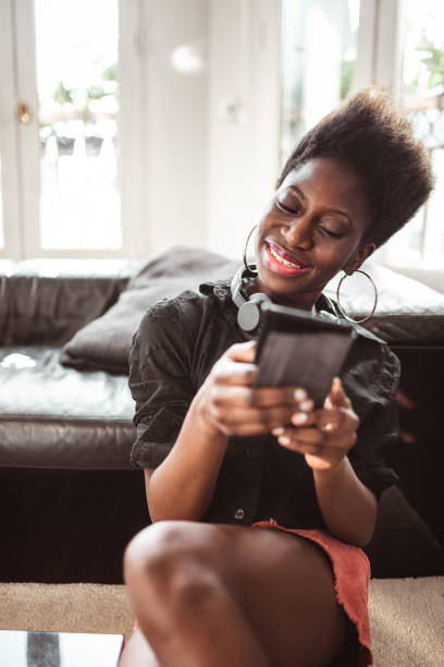istock woman on the phone at home 1166578100