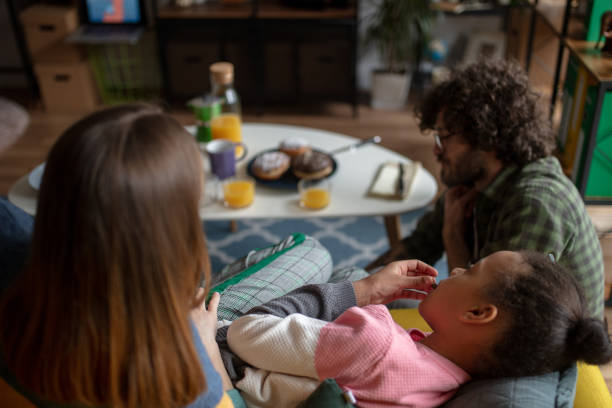 istock Family watching TV together 1166578134