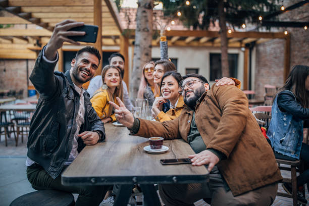 istock Friends group selfie outdoors in pub 1166578213