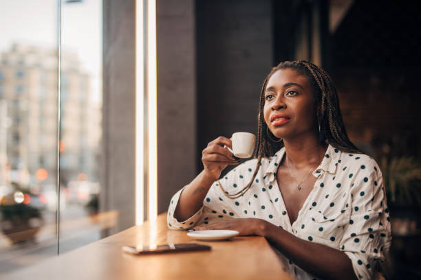 istock Woman drinking coffee at the cafe 1166578982