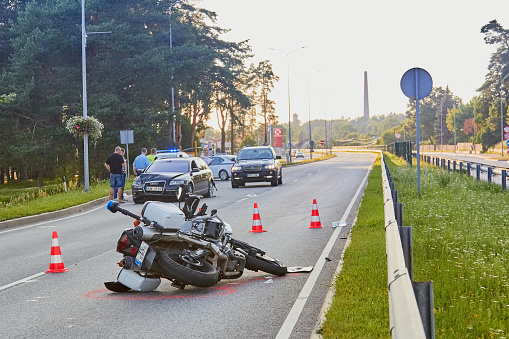 Car accident on a road in 24th of June 2019 in Ogre Latvia, police motorcycle after a collision with a car, transportation background