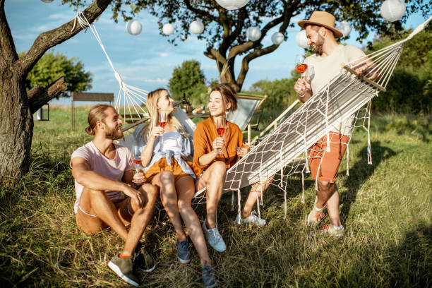 istock Friends relaxing with drinks in the garden 1166580934