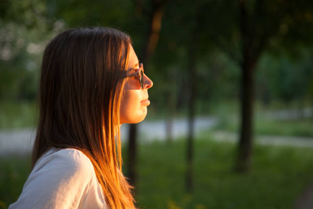 istock Woman looking at sunset 1166581923
