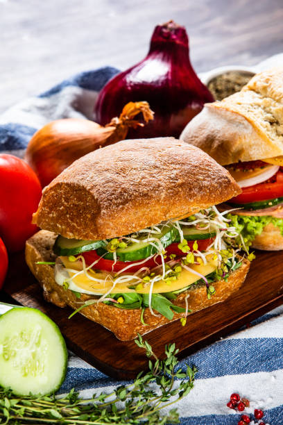 istock Big sandwiches on cutting board 1166582156