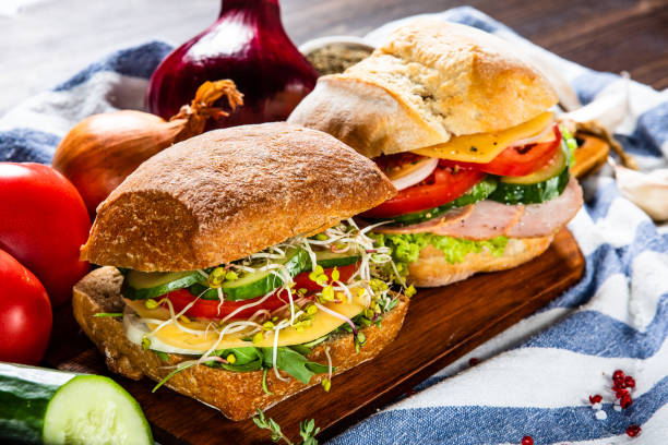 istock Big sandwiches on cutting board 1166582180