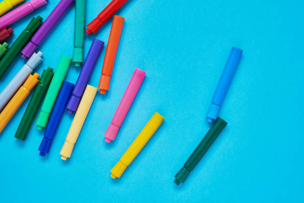 istock Colored felt tip pens on light blue background with place for text. Top view, copy space 1166582808