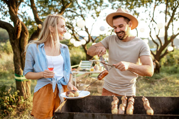 istock Couple having barbecue in the garden 1166583276