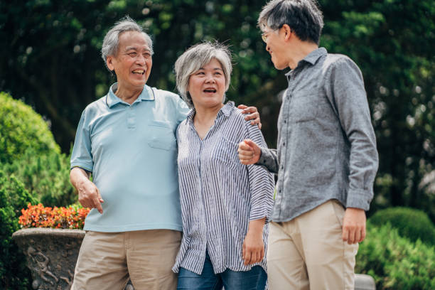 istock Three senior friends taking a walk in park 1166584317