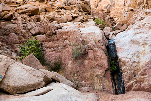 a picture of the natural recoloring of the rocks in the waterfalls of the sinai desert