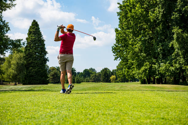 istock Close up Golfer is driving golf ball to green course 1166588152