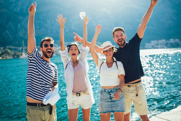 Happy group of tourists traveling and sightseeing together Happy group of tourists traveling and sightseeing together adriatic sea stock pictures, royalty-free photos & images
