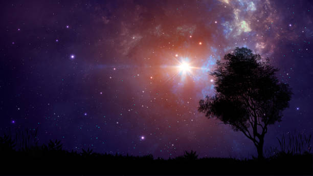 istock Space scene. Violet nebula with land and tree silhouette. Digital hand painted 1166588810