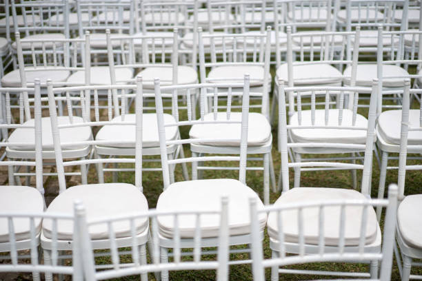 istock White chairs on top of grass field for wedding 1166589080