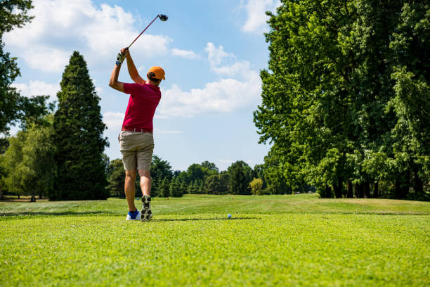 istock Close up Golfer is driving golf ball to green course 1166589250