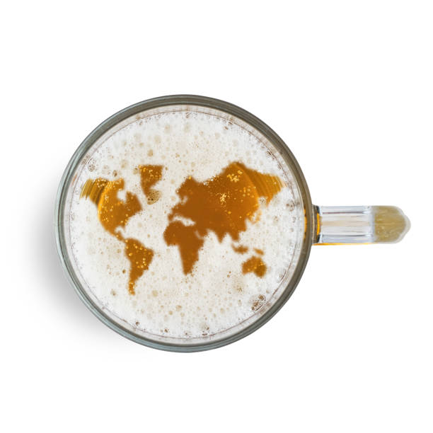 Symbol world map on the beer foam in glass isolated on white background. Top view stock photo