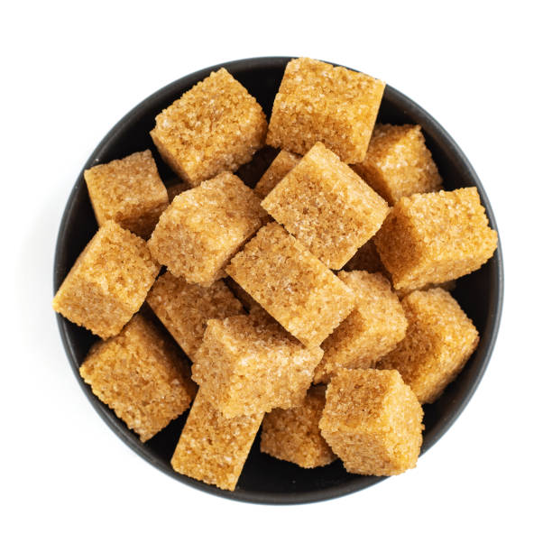 istock Brown sugar in bowl isolated on white background. Top view 1166590609