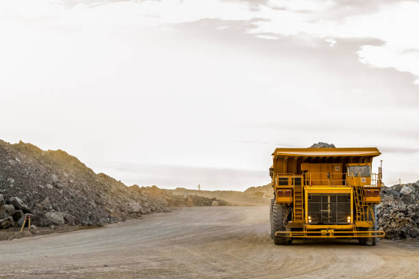 istock Large Yellow Dump Tip Trucks for transporting Platinum and Palladium Ore rocks 1166593656