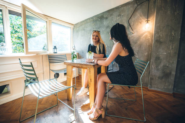 istock Two young women in cafe 1166593871