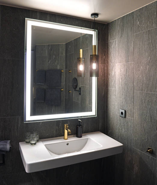 istock Bathroom interior with white sink and mirror 1166594555