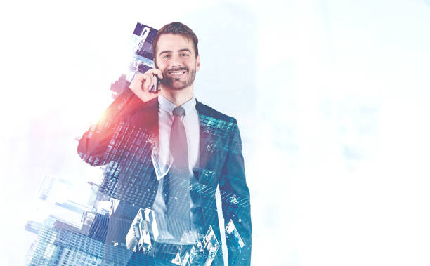 istock Cheerful businessman on smartphone in city 1166595663