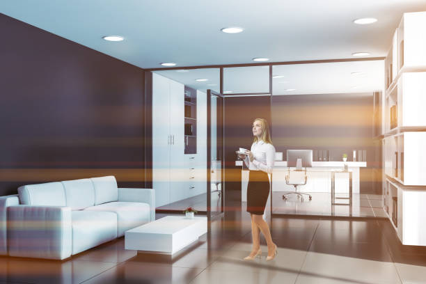 istock Woman in black CEO office with lounge 1166595698