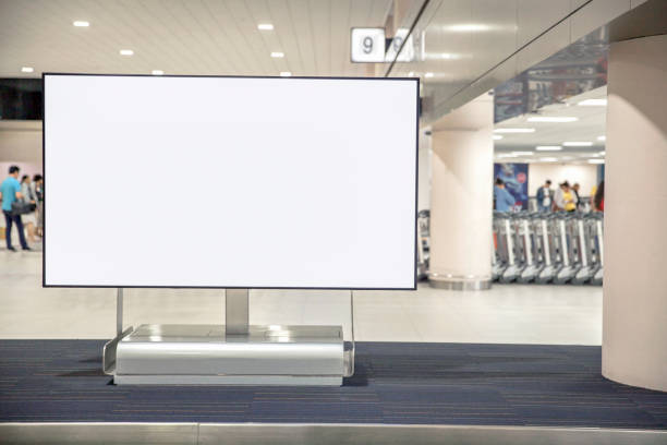 Digital Media blank advertising billboard in the airport , blank billboards public commercial with passengers, signboard for product advertisement design stock photo