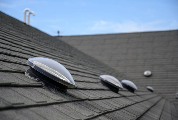 istock Dome shaped solar tube skylight on asphalt shingle roof 1166598010