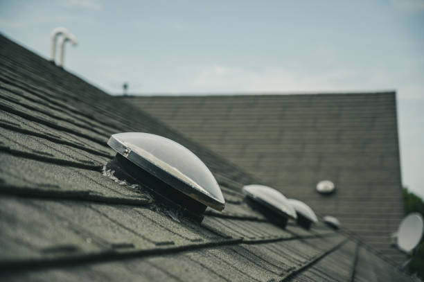 istock Dome shaped solar tube skylight on asphalt shingle roof 1166598015
