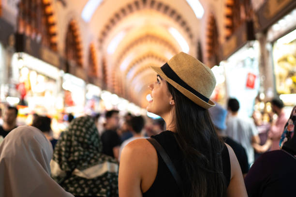 Rear view of a woman in awe at a grand bazaar, Istambul, Turkey Rear view of a woman in awe at a grand bazaar grand bazaar istanbul stock pictures, royalty-free photos & images
