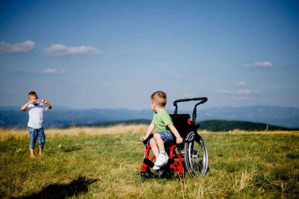 istock Disabled boy enjoying the nature with his brother 1166598082