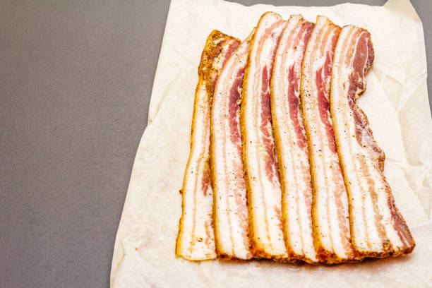 istock Slices of salted bacon with spices 1166598100