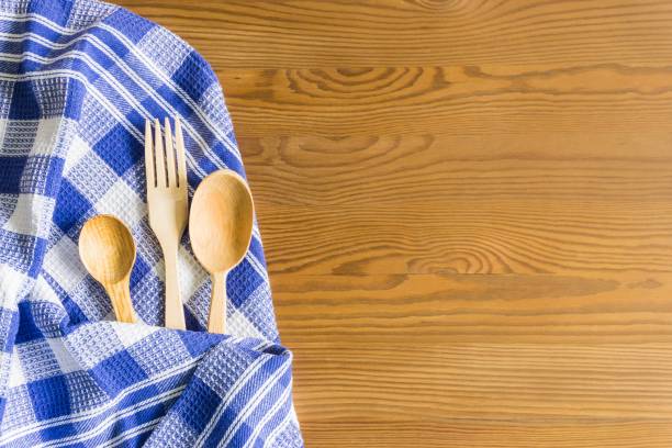 istock Wooden spoons on a wooden background. Flat lay, top view, copy space. 1166599270